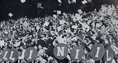 In an unusual Block I upheaval at the last home game, students toss their cards into the air. (Copyright Illini Media / 1961 Illio) Block I
